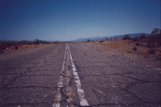 Sunbaked pavement.  Route 66 Arizona.  1991.